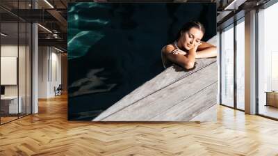 beautiful long hair female model posing by the pool, outdoor portrait Bali Indonesia Wall mural