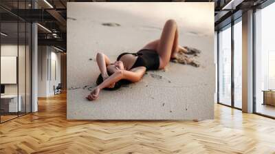 Close up portrait of beautiful young woman on the beach. Young caucasian female model on the sea shore. Wall mural