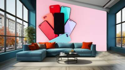 Set of colored plastic covers for smartphone isolated on a white background Wall mural