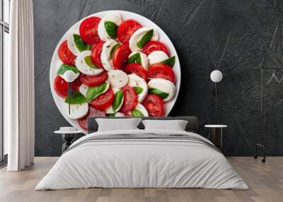 Italian caprese salad with tomatoes and mozzarella cheese with basil leaves Wall mural