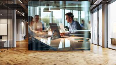 open space in a modern corporate office where business people are working on their laptops. Window reflections. Business and entrepreneurship concept.  Wall mural