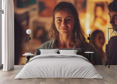 Young woman holding cardboard box in warmly lit room, representing moving, relocation, or volunteer work Wall mural