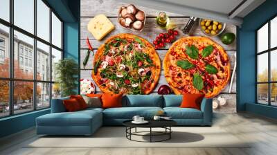 two pizzas and ingredients. Wall mural