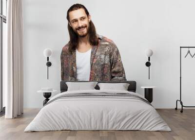 Smiling friendly fun guy, attractive and kind hippie. Hipster traveler stylish carefree man on a white studio background, people lifestyle Wall mural