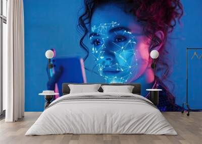 Woman holding a phone at facial recognition check. Face id technology background. Wall mural