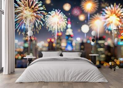 Blurred image of fireworks lighting up the night sky over a cityscape.
 Wall mural