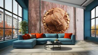 brown walnut fruit in a decorative plate Wall mural