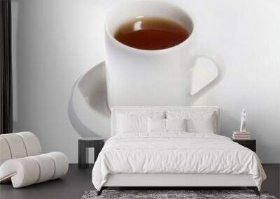 White cup with coffee tea on white
saucer on a white background Wall mural