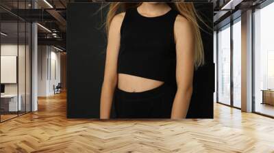 A beautiful young girl with blonde hair poses as a fashion model in different images and styles. Added noises and no sharp focus for the author's artistic design. Wall mural