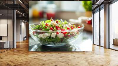 Fresh green salad with arugula, feta cheese, and red currants served in a glass bowl, perfect for a healthy summer lunch or side dish, featuring vibrant colors, soft textures, and natural light Wall mural