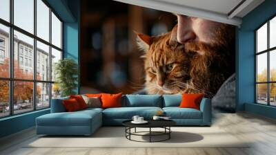 An affectionate portrait of a bearded man and his beloved pet orange cat Wall mural