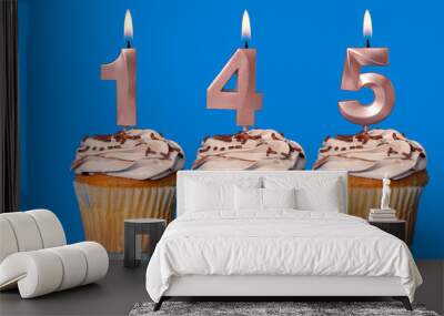 Birthday Cupcakes With Candles Lit Forming The Number 145. Wall mural