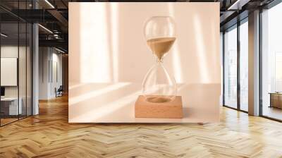 elegant glass hourglass on wooden base with morning light Wall mural