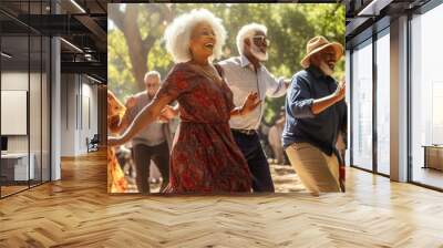 Group of diverse senior people dancing in park during festival. Wall mural