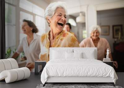 Group of happy active senior women laughing and dancing at home. Wall mural