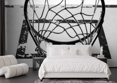 Basketball hoop in urban courtyard, black and white photo. Wall mural