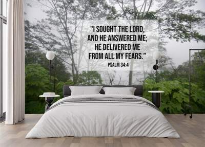 Bible verse inspirational quote - I sought the lord, and He answered me, He delivered me from all my fears. Psalm 34:4 With green forest background on a misty morning. Wall mural