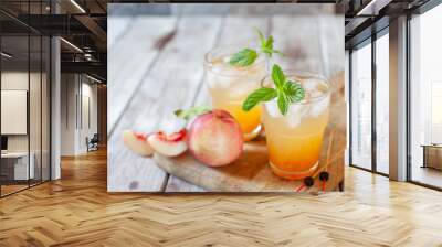 Peach cocktail with mint on white wooden background Wall mural