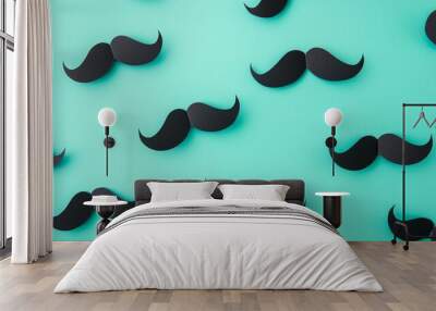 Playful black paper mustaches scattered on vibrant turquoise background, creating a whimsical pattern for Movember or costume party concepts. Wall mural