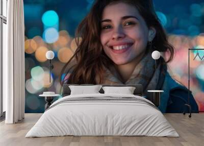 Radiant young woman enjoying a warm beverage on a chilly evening, her smile as bright as the twinkling city lights behind her, capturing urban joy. Wall mural