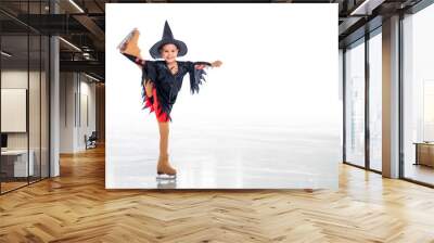 Little young skater posing in witch costume for halloween on ice on white background Wall mural