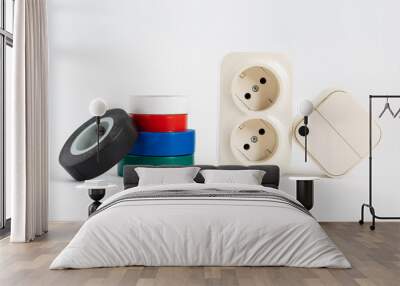 multicolored insulating tape, double socket and two-key light switch on white background. mechanical device for switching lighting circuit, two sockets connected by monolithic case. electronic devices Wall mural