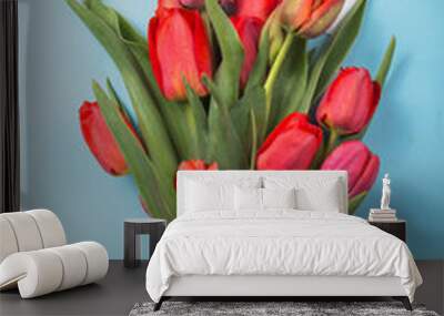 red  beautiful tulips in an ice cream waffle cone with card Womans Day on a concrete background. Conceptual idea of a flower gift. Spring mood Wall mural