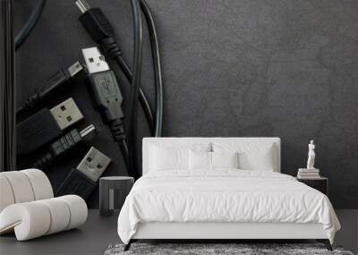 Close up USB and mini USB cables on black background with place for your design Wall mural