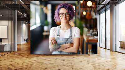 A young, gen z female entrepreneur with an unconventional style and purple hair stands confidently in her creative workshop or guitar shop, showcasing individuality and a spirit of nonconformity. Wall mural