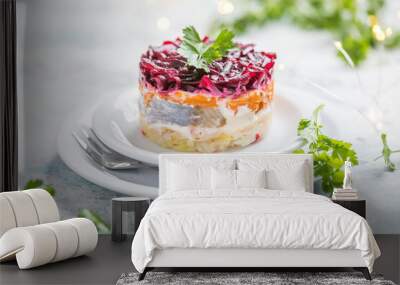 Shuba salad. Russian layered salad with beet, potato, carrot,  pickled herring and mayonnaise for Christmas dinner Wall mural