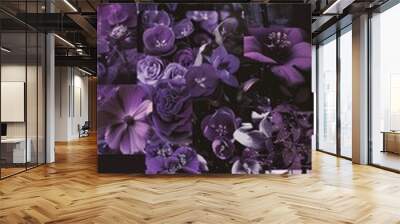 A collage of purple flowers and leaves Wall mural