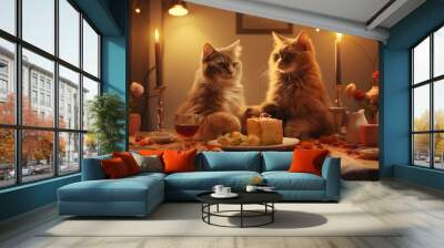 Two cats sitting at a dinner table with candles Wall mural