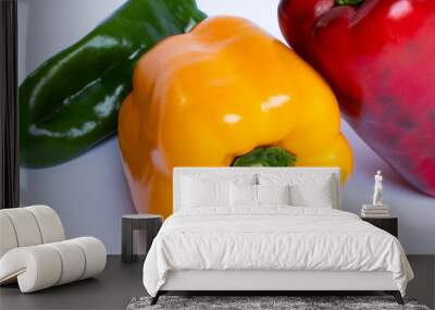 Closeup on three peppers on white background  Wall mural