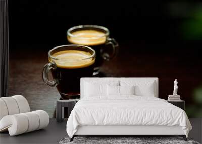 two glass coffee cup with espresso near the window in morning on dark background Wall mural