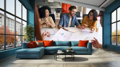 Group of smiling multiracial business people, colleagues talking, planning startup, sharing ideas working together in modern office. Meeting, teamwork, successful business Wall mural