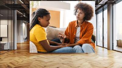 Mother comforts her sad teenage daughter, discussing family issues at home interior Wall mural