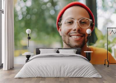 Portrait of a young creative professional smiling in a modern office Wall mural