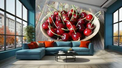 Cherries in a brown wooden bowl. Fresh organic summer berries Wall mural