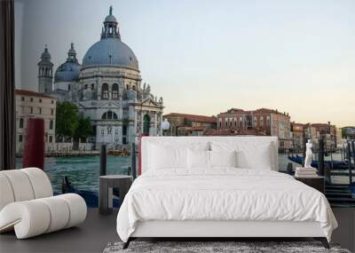 View of traditional gondolas on famous Grande Canal with historic Basilica di Santa Maria della Salute in the background in Venice, Italy Wall mural