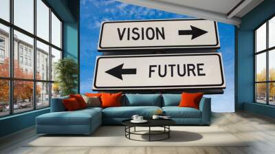 Vision vs future. White two street signs with arrow on metal pole with word. Directional road. Crossroads Road Sign, Two Arrow. Blue sky background. Two way road sign with text. Wall mural