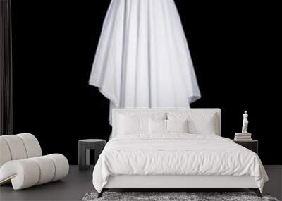 White ghost with black eyes, made from a bedsheet. Isolated on black background. Wall mural