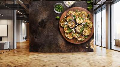 Fried eggplant with feta, pine nuts, fresh herbs (cilantro, parsley) and olive oil. Tasty vegetable snack, summer, spring food, picnic Wall mural