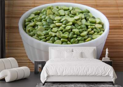 Green dry peas in white ceramic cup Wall mural