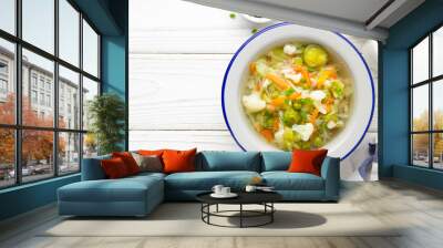 Vegetable soup with cauliflower, Brussels sprouts, white cabbage, carrots and green peas. Delicious healthy lunch, spring food Wall mural