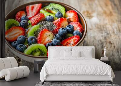 Close-up of a healthy breakfast bowl, filled with vibrant fruits on a rustic wooden table Wall mural