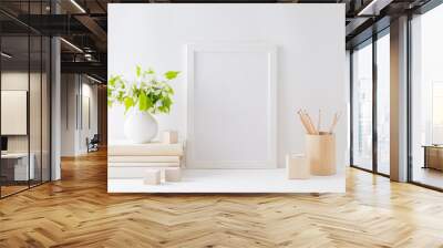 Home interior with decor elements. Mockup with a white frame, spring flowers in a vase on a light background Wall mural