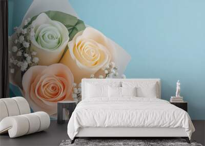 Pastel colored rose flower candle wrapped in light pink paper Wall mural