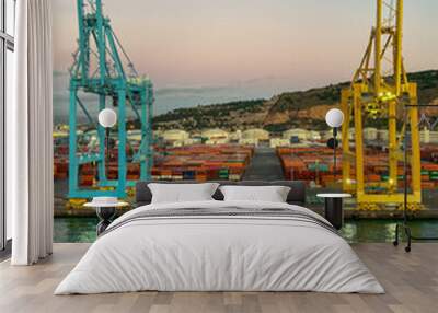 Panoramic view of cargo port in Barcelona. Freight transportation by container ship in harbor. Colorful containers at port logistics. Barcelona, Spain.  Wall mural