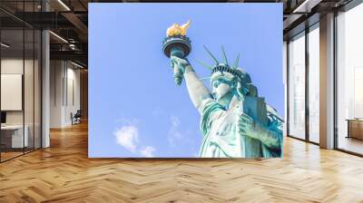 Close view of the Statue of Liberty over blue sky Wall mural