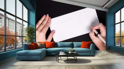 Female hands writing on white paper with feather vitage pen with copy space Wall mural